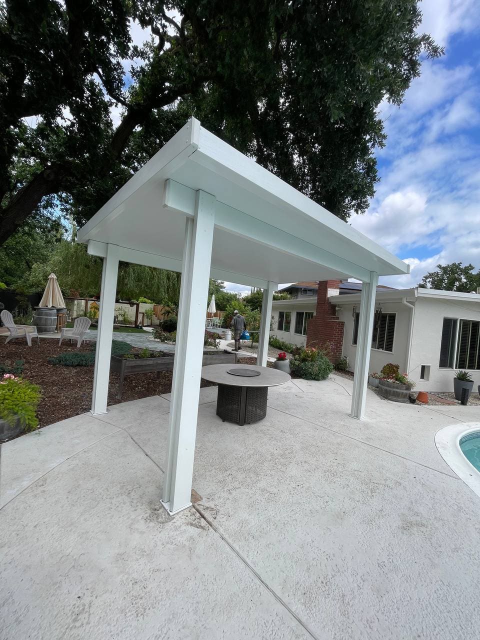 Freestanding white solid insulated aluminum patio cover poolside cabana in Fair Oaks, CA.