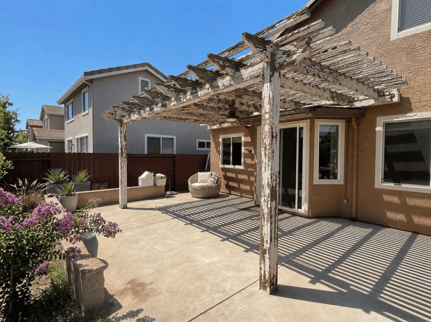 Traditional wood pergola / patio cover showing weathered wood construction